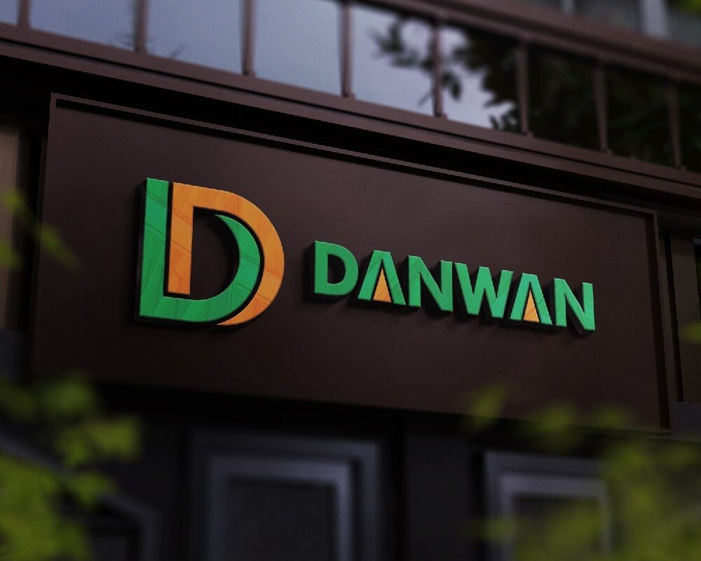 Danwan 3D logo signage on a dark office facade