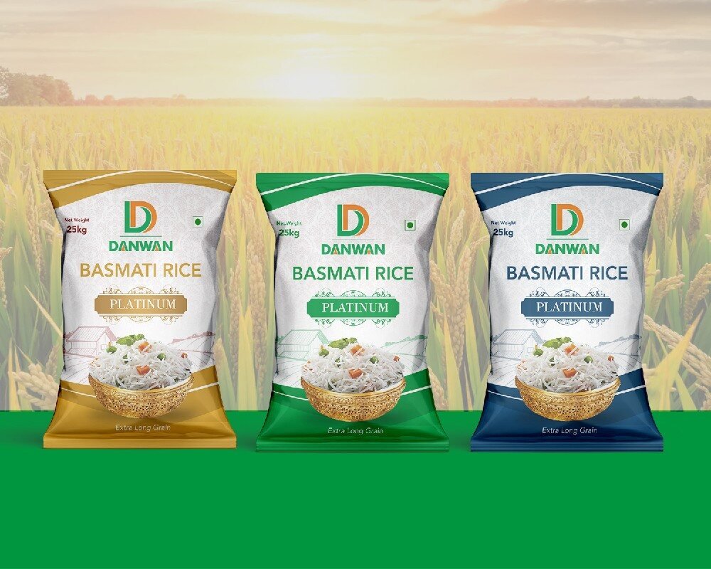 Danwan basmati rice pack range of three bags set against a golden paddy field