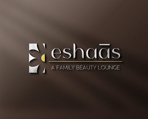 Eshaas embossed logo on a brown textured surface