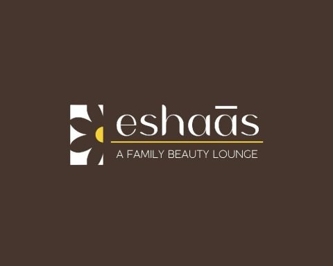Eshaas a family beauty lounge logo reversed on brown