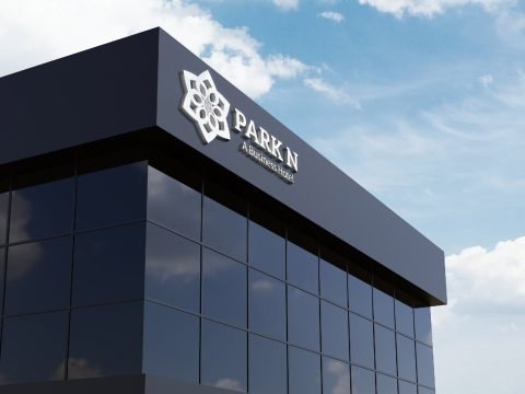 Park N hotel logo signage on a modern glass building facade
