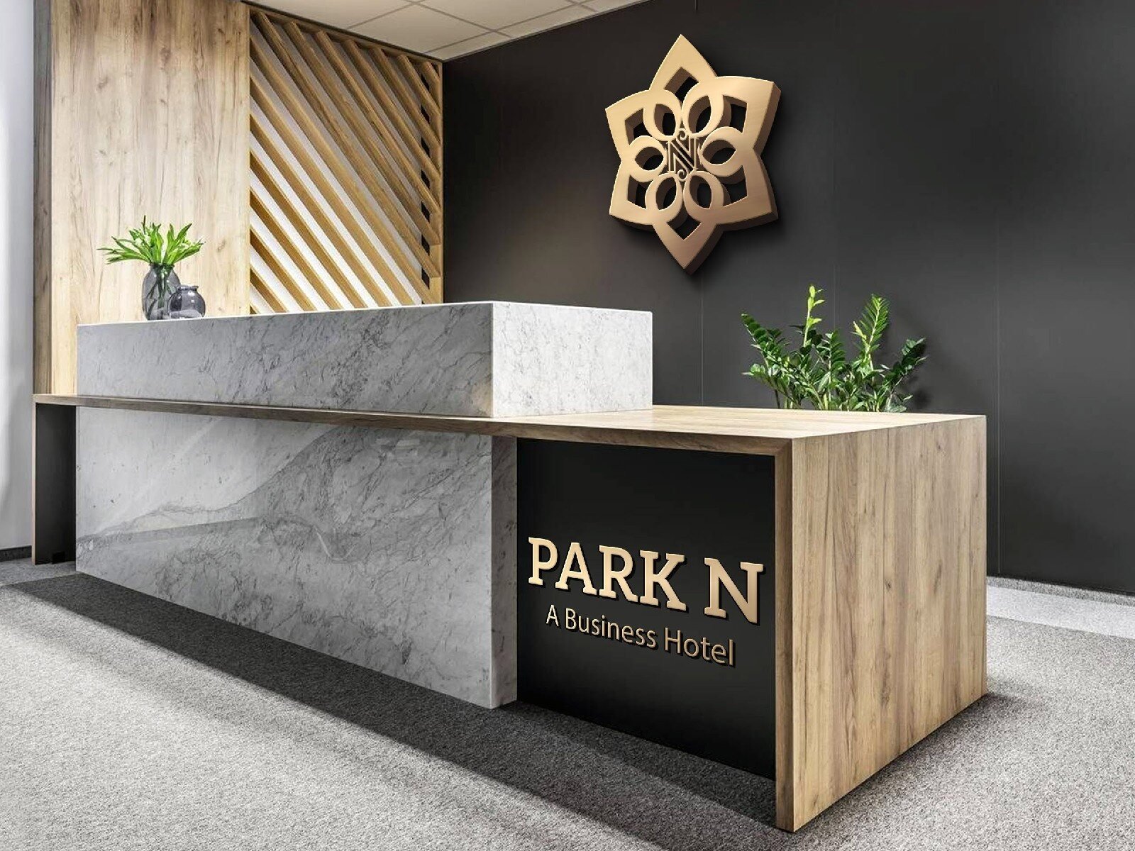 Park N business hotel reception desk with gold logo signage